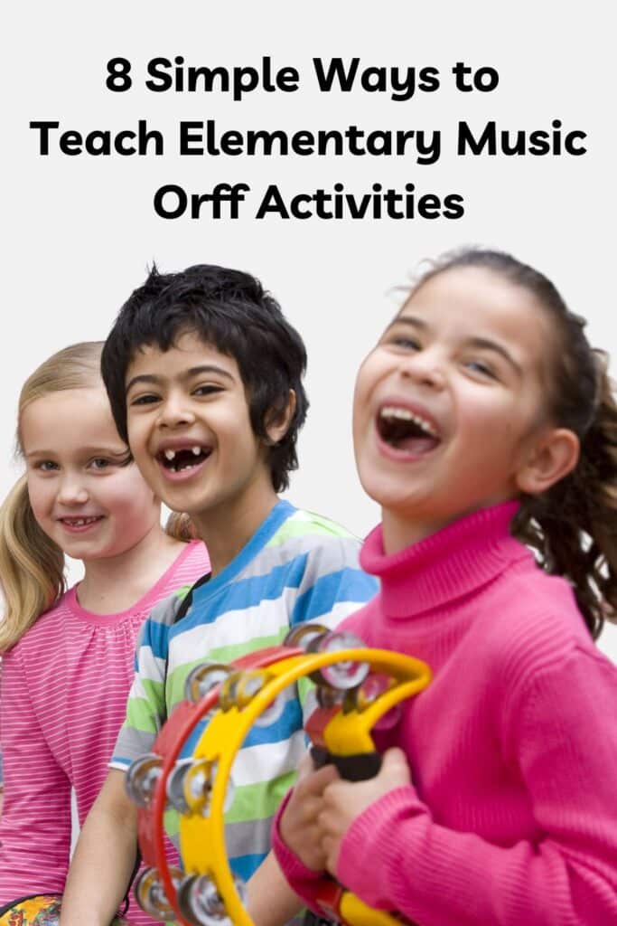 Elementary-age students play classroom music instruments