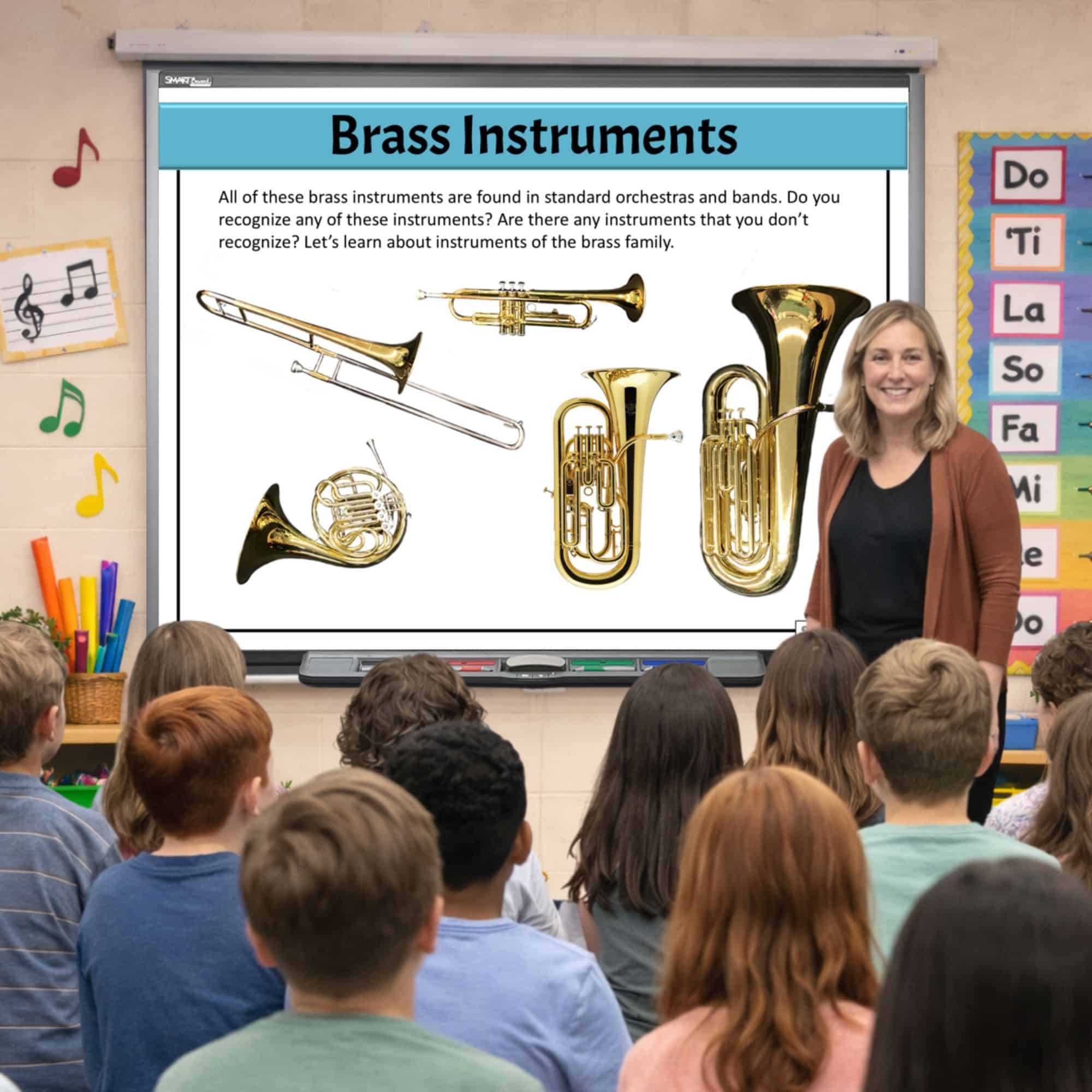 Elementary music teacher teaching upper elementary students. Brass family musical instruments are visible on the classroom whiteboard.