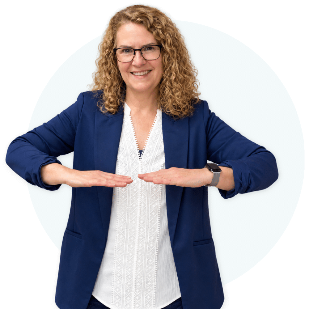 Terri Lloyd, elementary music teacher, demonstrating "Mi" solfege hand sign